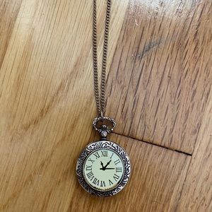 gold timepiece necklace